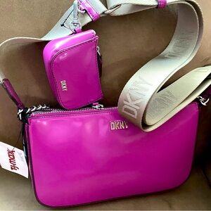New with tags DKNY purple crossbody purse with guitar strap